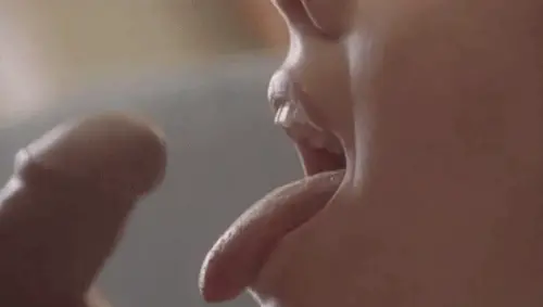 watch as stream of delicious cum shoots from cock into wide open mouth.  big smile as she swallows... porn gif