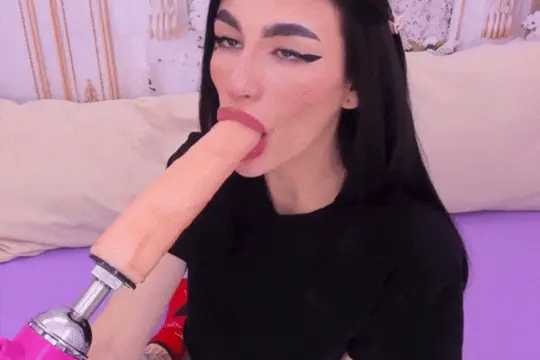 nasty brunette deepthroating a huge dildo porn gif