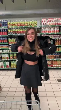 cutie flashing her big boobs at the supermarket porn gif