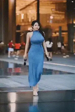 strolling by with the biggest tits in the city porn gif