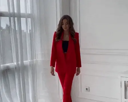 immaculate brunette beauty presenting her sexy red suit outfit porn gif