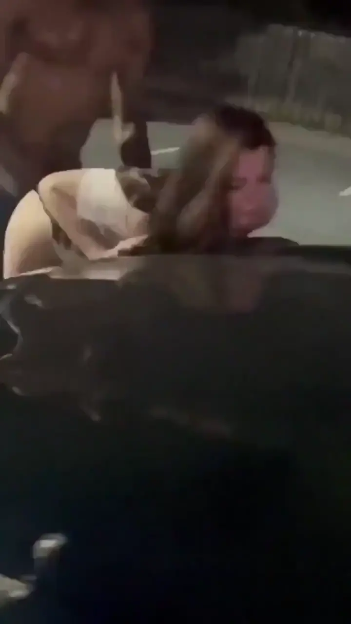 Young White Girl submissive against a car in public blacktowhite