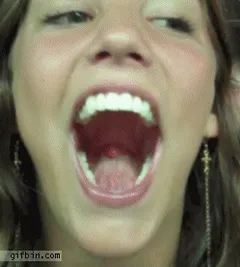 cute brunette swallows her own tongue