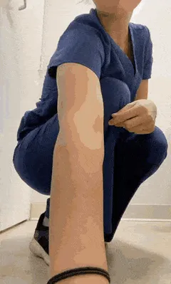 nurse putting in butt plug
