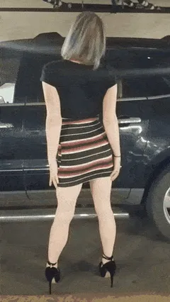 pulling up her skirt to show us her butt plug in public