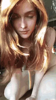 cute redhead showing off her naked body