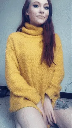 i've got a surprise under this big yellow sweater