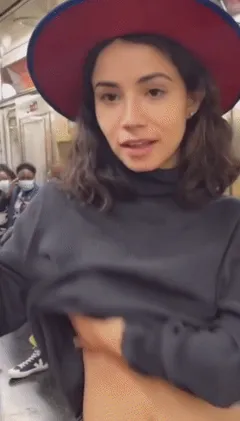flashing her small peirced tits on the train