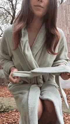 in the yard naked under her robe