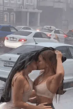 Pouring Rain kissing outdoors